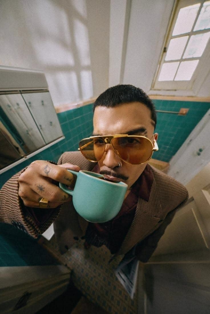 A man drinking from a mug